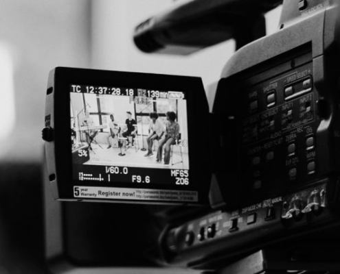 person operating video camera