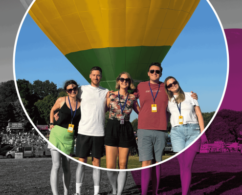Community-relations---why-choose-us Community Relations - team in front of a balloon at Bristol International Balloon Fiesta